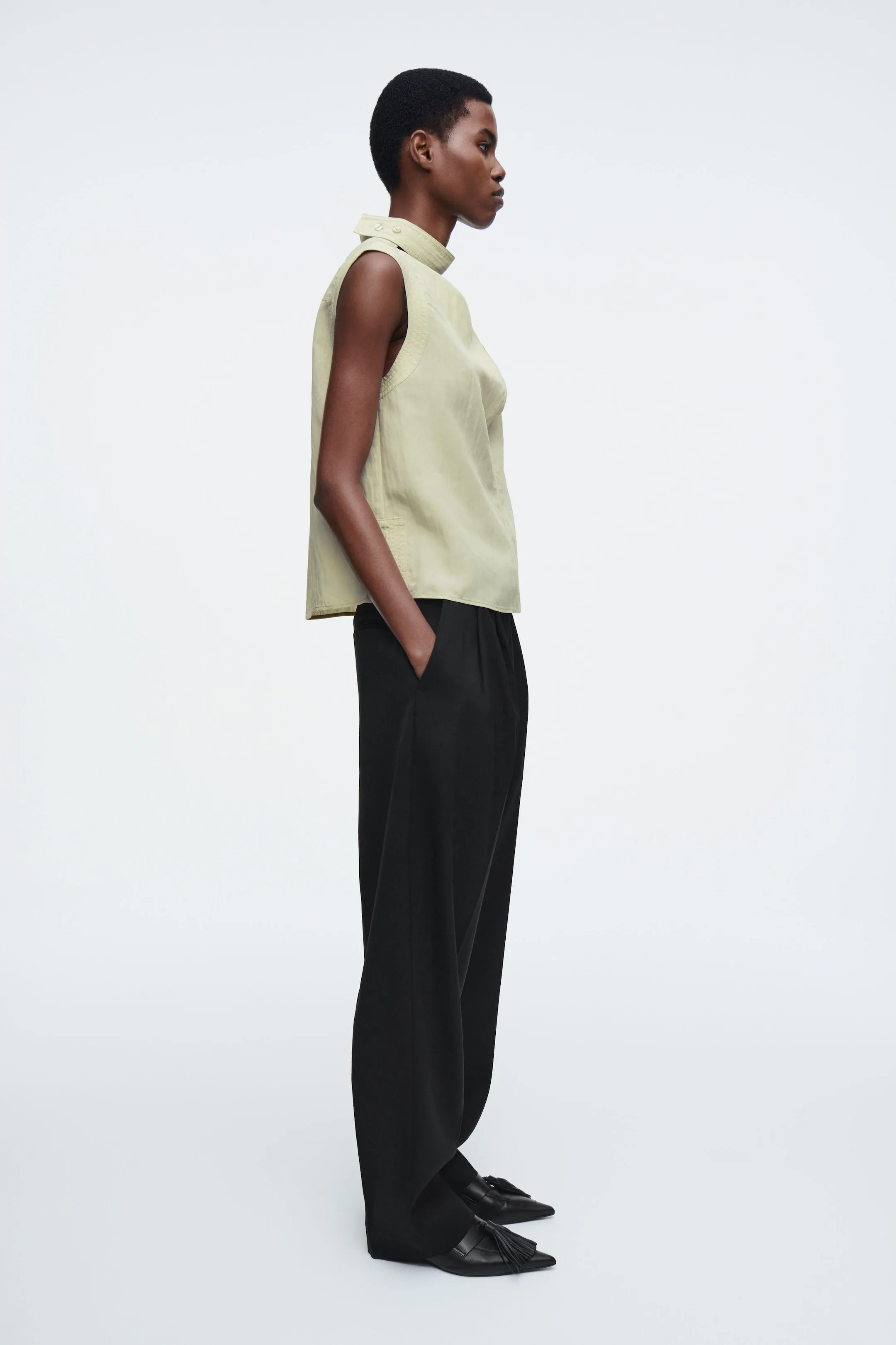 Sleeveless cut-out cowl-neck blouse