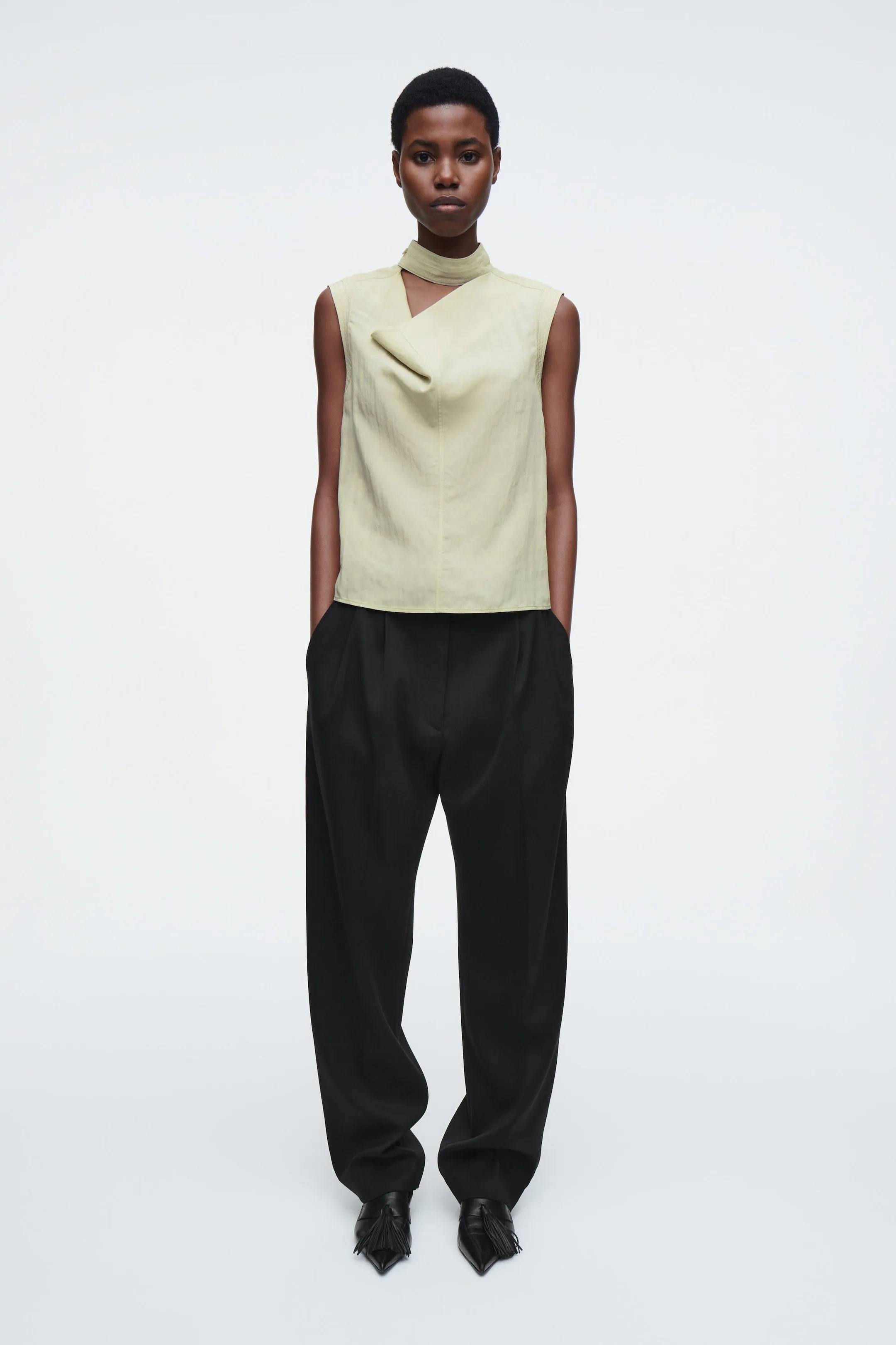 Sleeveless cut-out cowl-neck blouse