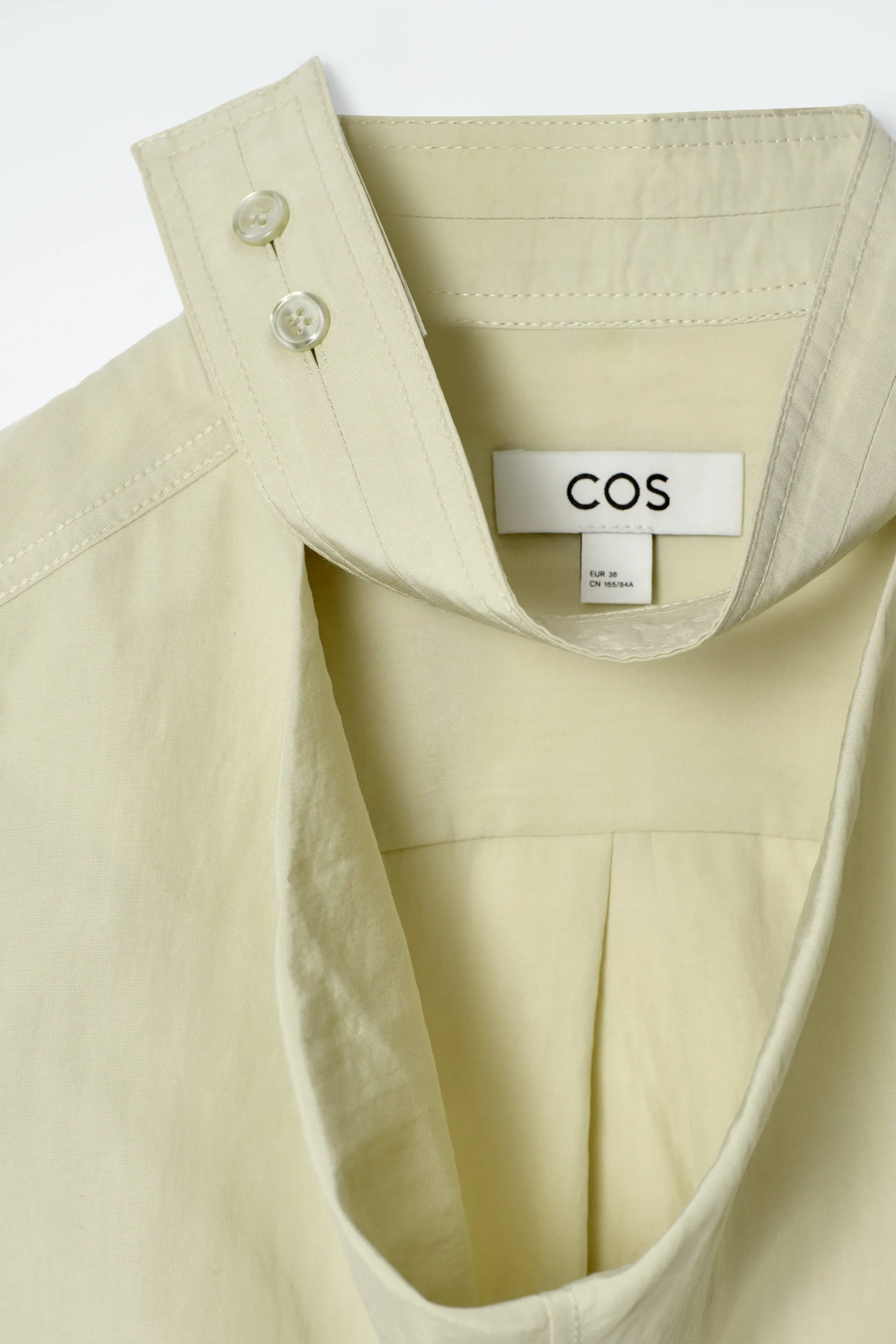Sleeveless cut-out cowl-neck blouse