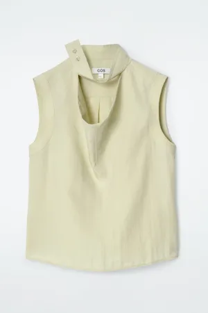 Sleeveless cut-out cowl-neck blouse
